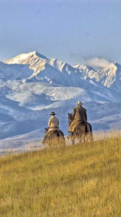 Cowboys ride open rangeland in Big Sky Country (Shutterstock)