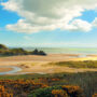 Three Cliffs Beach is backed by limestone cliffs and a wild shoreline of sand dunes, rock pools and salt marsh (Alamy)