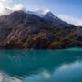 A panoramic view of the mountain landscape on the ocean coast during a cloudy and colourful morning in fall season, Glacier Bay, Alaska