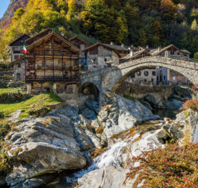 Beautiful bridge in Rassa, Italy, during autumn
