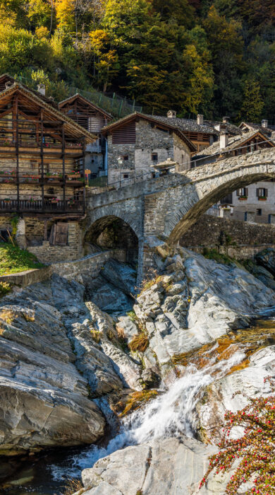 Beautiful bridge in Rassa, Italy, during autumn