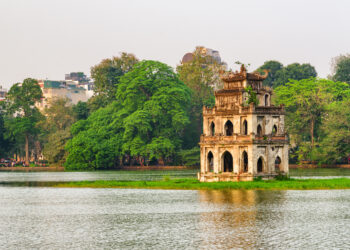 Sunset view of the Turtle Tower in middle of the Hoan Kiem Lake (Lake of the Returned Sword)