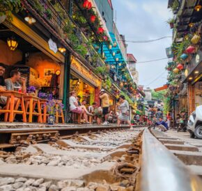 Low-angle shot taken from the track showing Hanoi Train Street