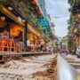 Low-angle shot taken from the track showing Hanoi Train Street